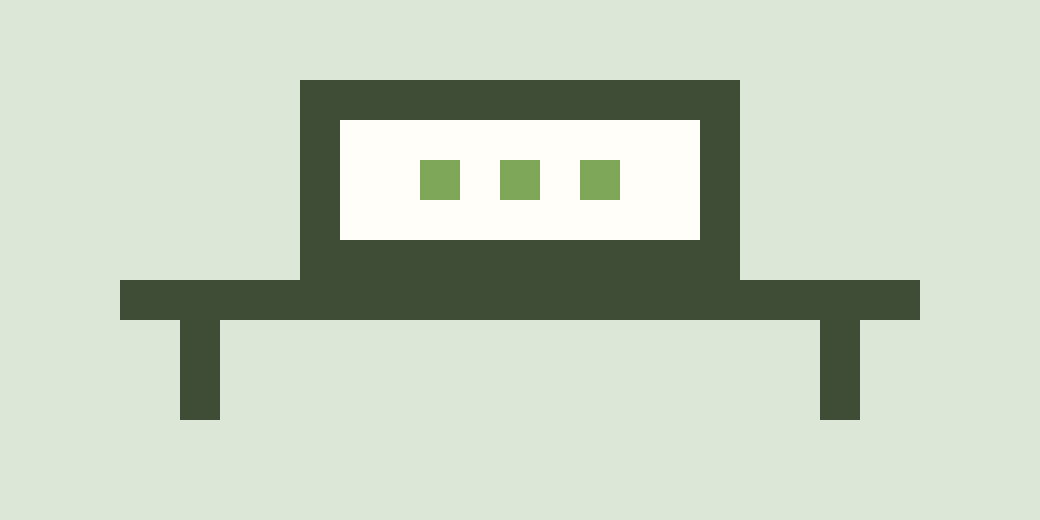 A small pixelated box on a desk, with green indicator lights on.