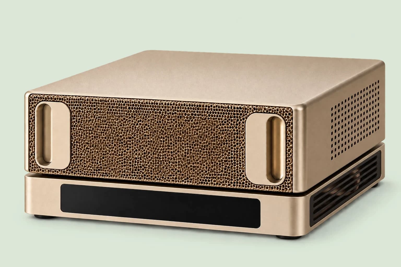 The Appliance: a compact champagne-coloured unit, with a honeycomb front between two handles and a black band.